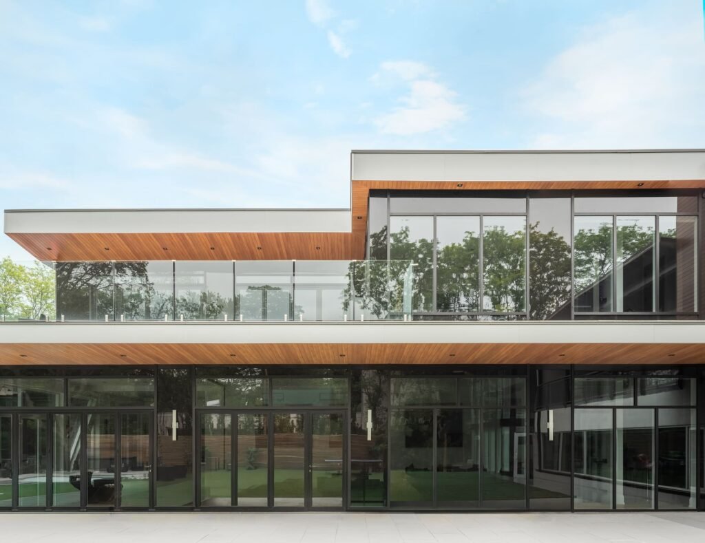 Modern home utilizing vedrex woodgrain aluminum cladding systems and soffit systems