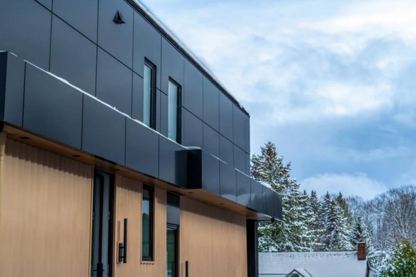 Aluminum siding on commercial building in Canadian winter