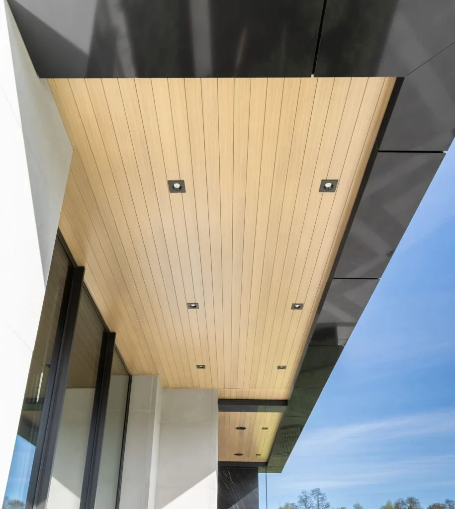 Showing what is soffit on a building exterior using a wood grain aluminum soffit panels