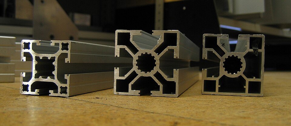 Extruded aluminum profiles showing complex cross-sections produced through aluminum extrusion