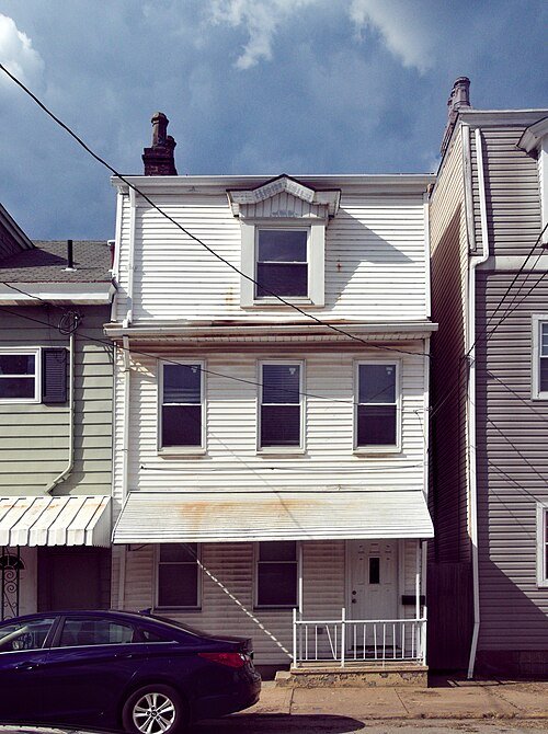 Traditional horizontal aluminum siding illustrating the residential style common in North America